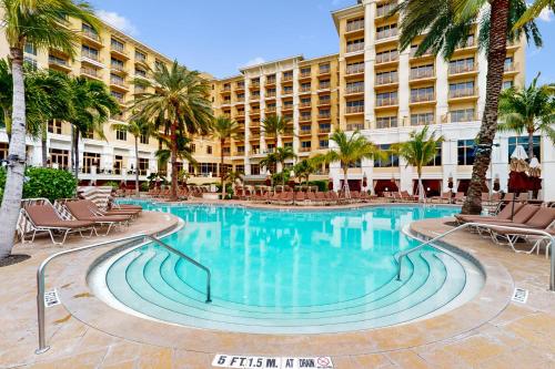 a swimming pool in front of a hotel at Sandpearl unit 757 in Clearwater Beach