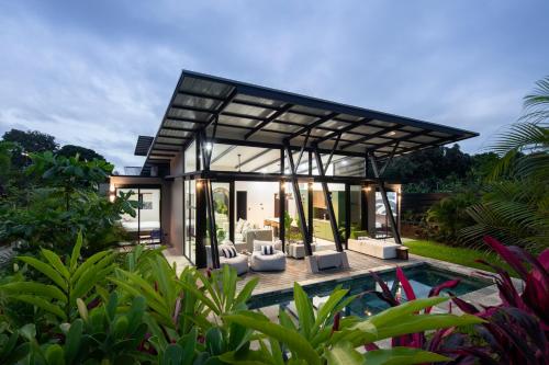 a modern house with a pool in a garden at BAUMA in Fortuna