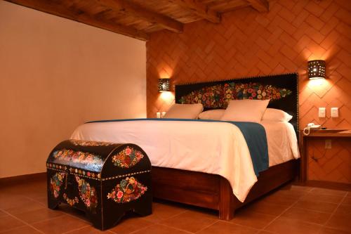 Ένα ή περισσότερα κρεβάτια σε δωμάτιο στο Hotel Mansion Del Valle