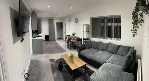 a living room with a couch and a table at Coatham house in Redcar