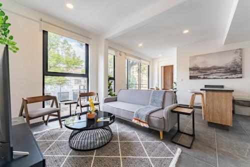 a living room with a couch and a table at Doctores Apartments by VH in Mexico City