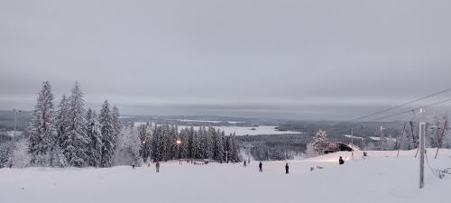 a group of people on a ski lift in the snow at Villa Lilja in Muurame