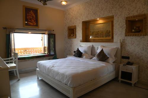 Cama o camas de una habitación en K D PALACE - Heritage Hotel On Fort