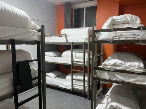 a group of bunk beds in a room at Heroesbunkz in Newcastle upon Tyne