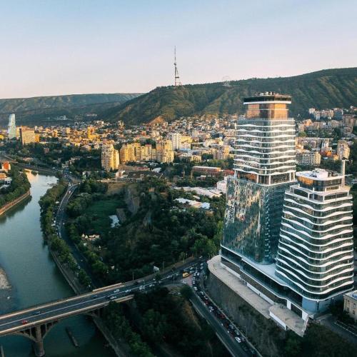 an aerial view of a city with a large building at King david royal Dan floor 21 in Tbilisi City