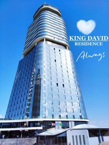 a tall building with the words king david residence advisors at King david royal Dan floor 21 in Tbilisi City
