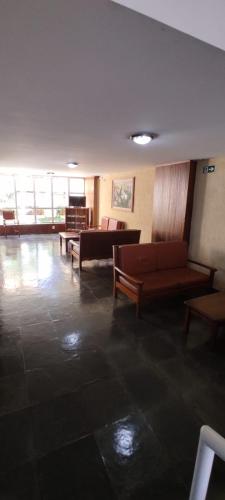 a living room with couches and a couch at HOTEL MARAMBAIA in Guaxupé