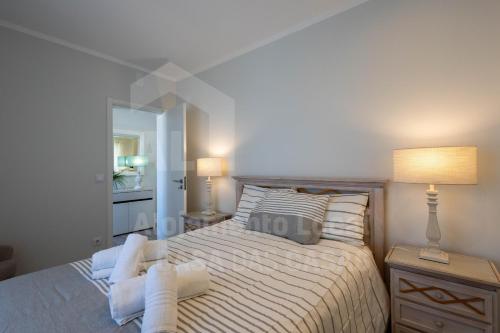 Ένα ή περισσότερα κρεβάτια σε δωμάτιο στο Ribas Apartment by ACasaDasCasas