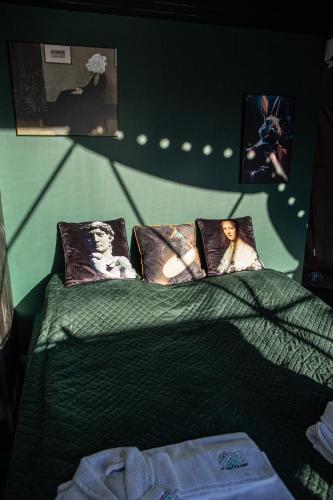 a bedroom with a bed with pictures on it at BUNNY GLAMP in Korbielów