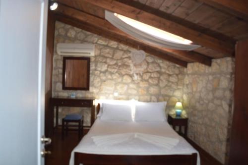 Ένα ή περισσότερα κρεβάτια σε δωμάτιο στο The Guesthouse Katochori