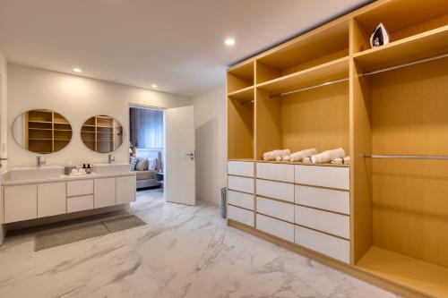 a bathroom with a sink and a mirror at Lumina at Marea Cabo San Lucas in Cabo San Lucas
