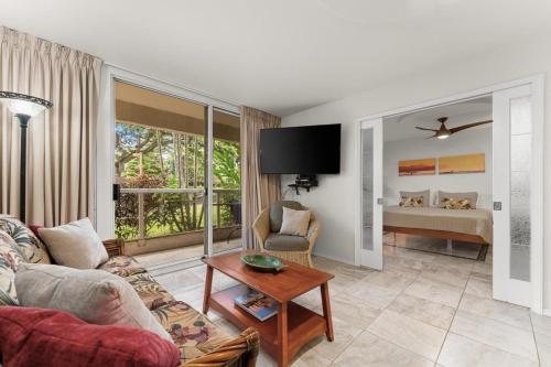 a living room with a couch and a table at Luxury Condo at Kameole Beach T106 in Wailea