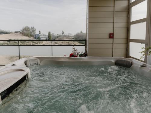 a jacuzzi tub sitting on top of a house at Domein Westhoek in Oostduinkerke