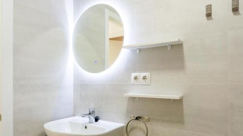 a bathroom with a sink and a mirror at Juanito Fuengirola Apartment in Fuengirola