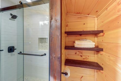 a bathroom with a shower and a glass shower stall at Forested Ellijay Cabin Rental with Private Hot Tub! in Ellijay