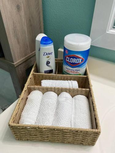 a basket of toilet paper and a container of toiletries at 4 FREE Kayaks for use & short drive to the beach! in Bolivar Peninsula