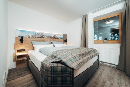 Postel nebo postele na pokoji v ubytování Living Mountain Tannheim