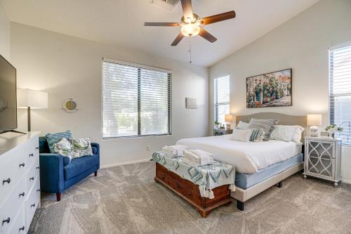 a bedroom with a bed and a ceiling fan at Goodyear Home with Pool, 6 Mi to Spring Training! in Goodyear