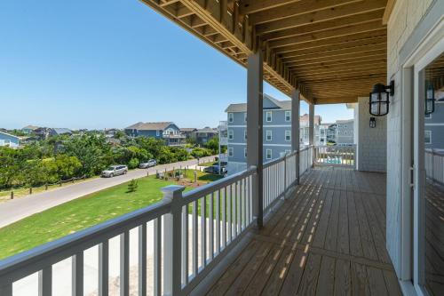 a balcony with a view of a street at Zensation 14 Bedroom Home by KEES Vacations in Salvo