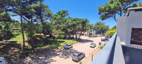arial view of a street with cars parked in a parking lot at PuroBeach in Mar Azul