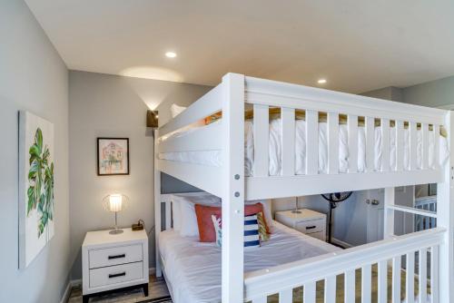 a white bunk bed in a childs bedroom at St Helena Island Vacation Rental Walk to Beach! in Oceanmarsh Subdivision