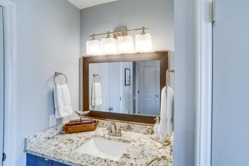 a bathroom with a sink and a mirror at St Helena Island Vacation Rental Walk to Beach! in Oceanmarsh Subdivision