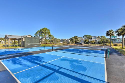 a tennis court with a net on it at St Helena Island Vacation Rental Walk to Beach! in Oceanmarsh Subdivision