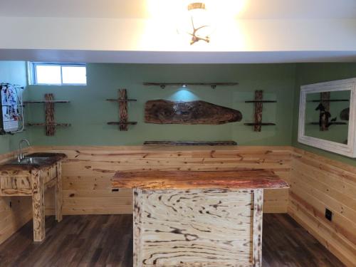 a sauna with a wooden counter and a sink at Boot Lake Retreat in Steuben