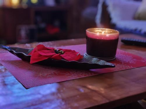 a candle sitting on top of a table with a napkin at Vila Antić in Pirot