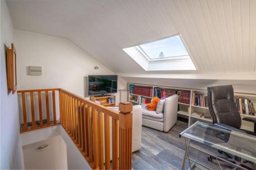 a living room with a skylight in a house at Maison vue SEMNOZ in Annecy
