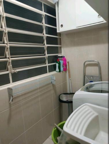 a small bathroom with a sink and a toilet at Aconchego 1 in São Roque