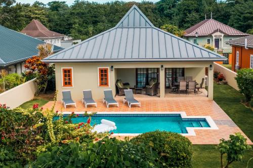 an aerial view of a house with a swimming pool at Bram Villa in Canaan