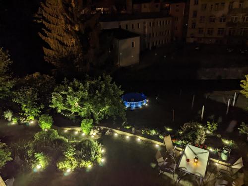 an overhead view of a courtyard at night with lights at HW3 - Urlaubsmagie - Helle, große Wohnung mit Pool in Sebnitz