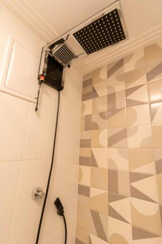 a shower in a bathroom with a shower at Elegant Studio - GRU 1506 in Guarulhos