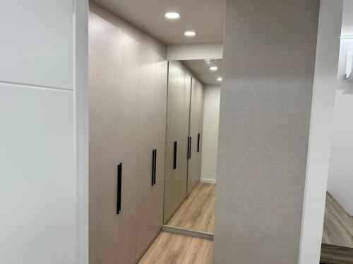 a hallway with a row of lockers in a building at Loft independiente de Lujo. in Valencia