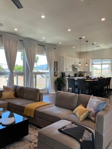 a living room with a couch and a kitchen at The Verna Mae in Los Angeles