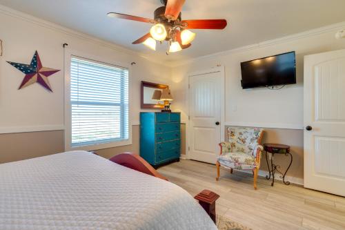 a bedroom with a bed and a ceiling fan at On-Site Lake Access and Fire Pit Bonham Home! in Bonham