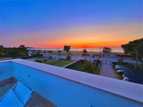 a view of a sunset from the balcony of a building at Villa Latino in Vieste