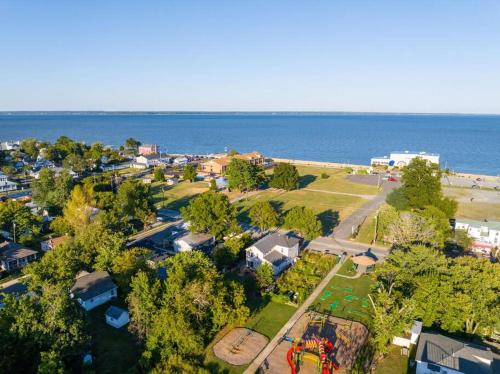 an aerial view of a park next to the ocean at The Lyellton House: Water View, Steps from Beach in Colonial Beach