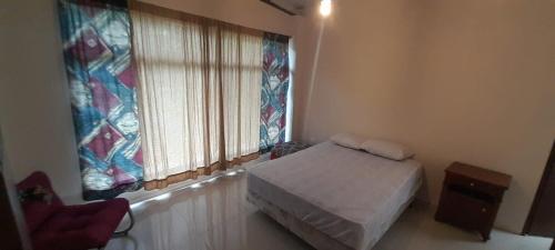 Postel nebo postele na pokoji v ubytování Bamburé