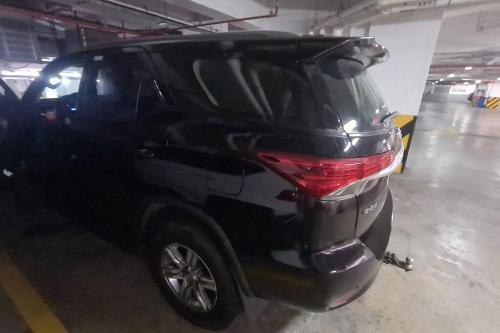 a black car is parked in a garage at Ecusuites Penthouse Vía Costa Ceibos Puerto Azul in Guayaquil