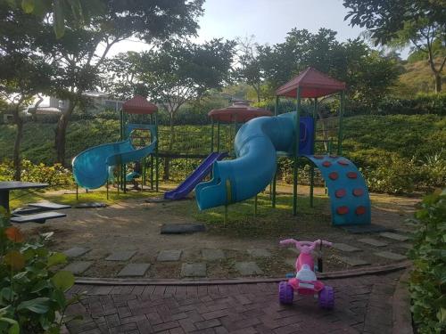 a childs playground with a slide at Ecusuites Penthouse Vía Costa Ceibos Puerto Azul in Guayaquil