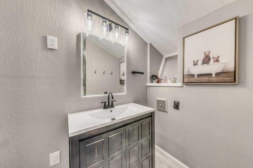 a bathroom with a sink and a mirror at Ruidoso Retreat with Mtn Views about 20 Mi to Ski Apache in Ruidoso