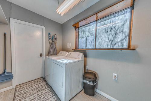 a laundry room with a washing machine and a window at Ruidoso Retreat with Mtn Views about 20 Mi to Ski Apache in Ruidoso