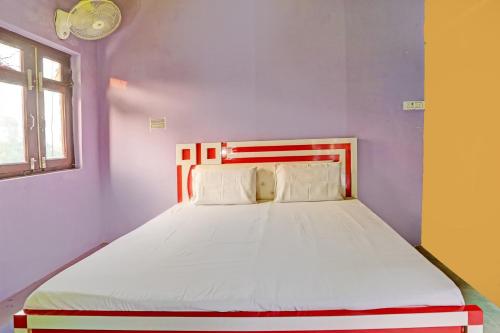 Postelja oz. postelje v sobi nastanitve OYO 81808 Hotel Royal Residency
