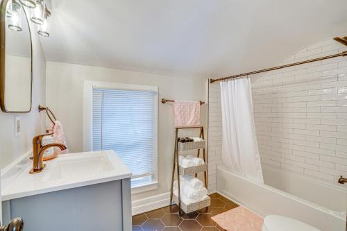 a white bathroom with a sink and a shower at Chic New Hartford Apartment - Hike, Golf and Ski! in New Hartford