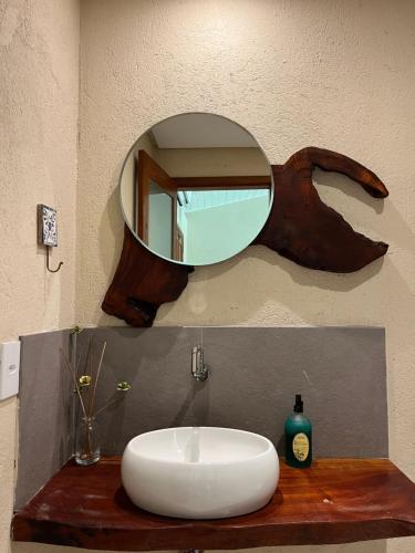 a bathroom with a sink and a mirror at Ocacocar - Milagres in São Miguel dos Milagres
