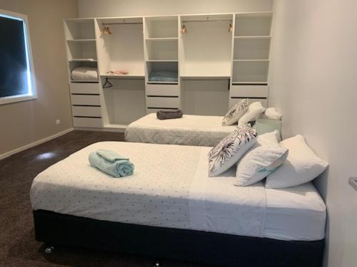 Ένα ή περισσότερα κρεβάτια σε δωμάτιο στο The Residence at MobyDick Resort