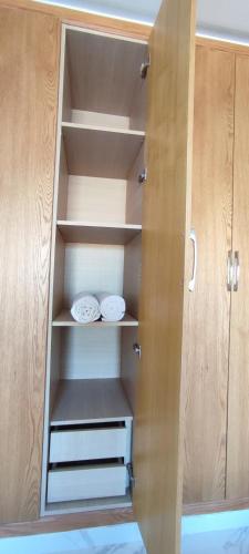 a cupboard with two plates on the shelves at surf house Agadir in Tama ou Ennza