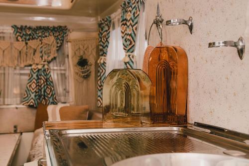 a kitchen with a sink and a bottle on the counter at Splitters Farm in Sharon